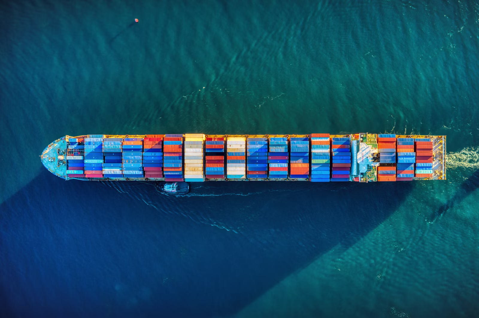 Container ship at open sea, seen from above